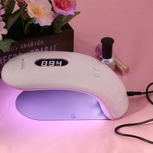 La femme peut tenir la moitié de la lampe de thérapie Light Therapy Rainbow 2